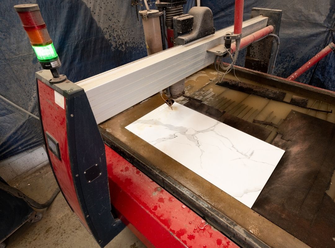 waterjet cutting through ceramic