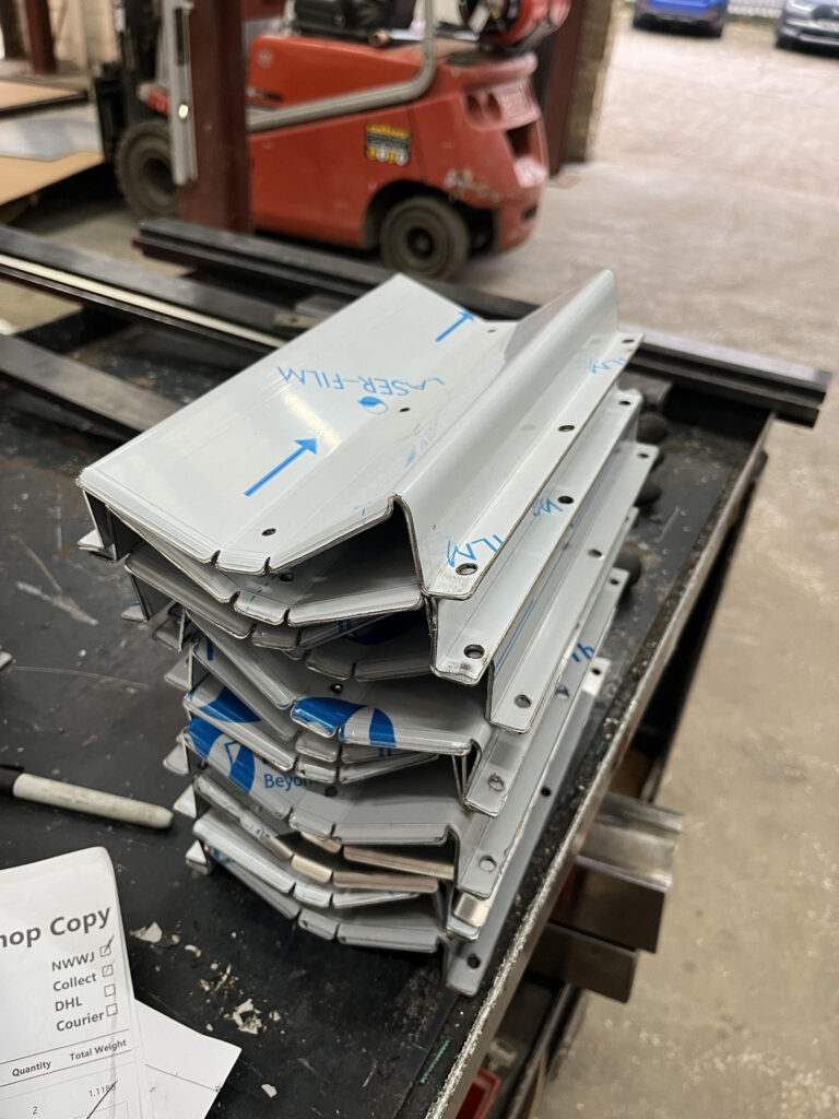 Finished folded metal components prepared from workshop drawings