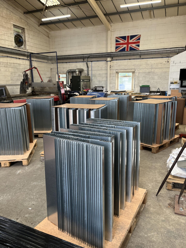 North West Waterjet workshop showing metal components and production space